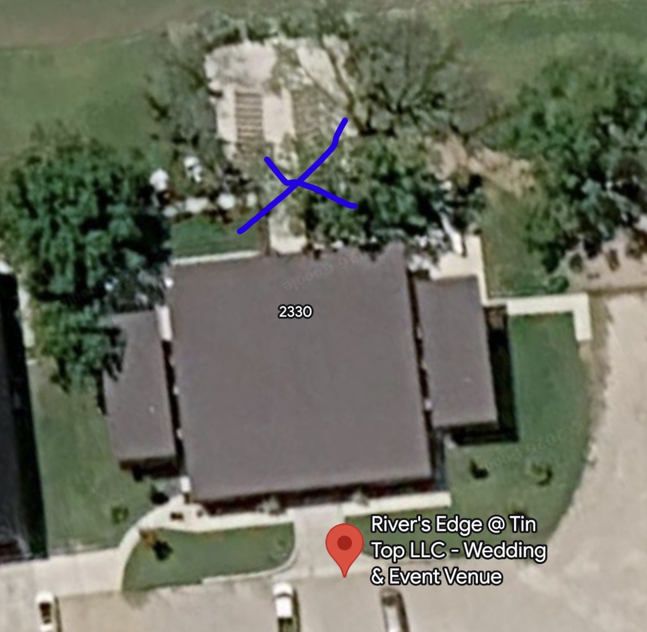 Aerial view of the venue with an X marking the ceremony area behind the building