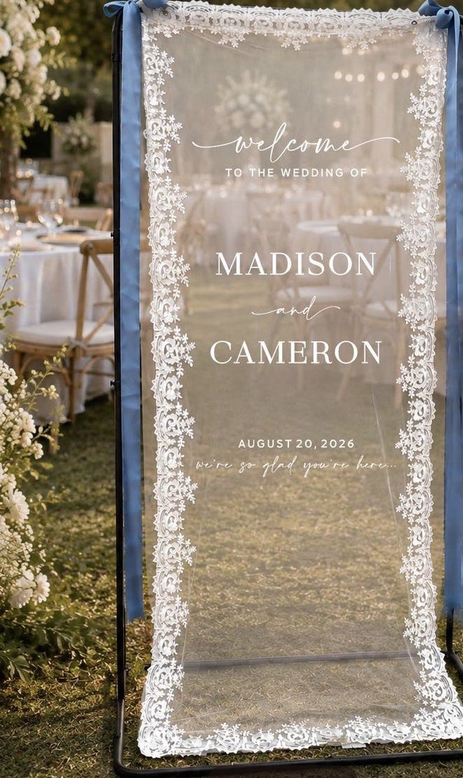 Lace sign hung on its stand with ribbon